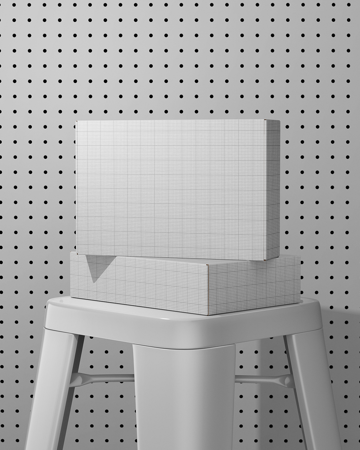 White box Mockup with grid pattern on a gray stool against a pegboard background