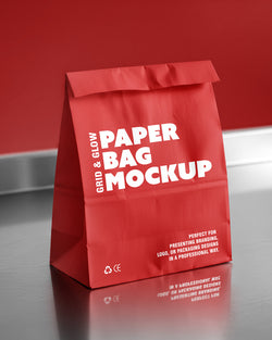 Paper bag mockup in red with reflective surface and fold-top closure