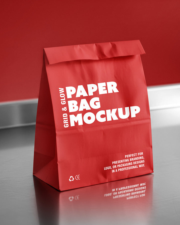 Paper bag mockup in red with reflective surface and fold-top closure