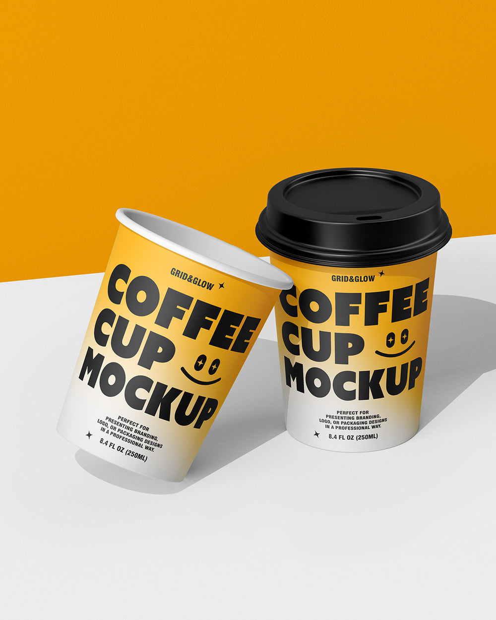 Two coffee cup mockups in leaning arrangement showing customizable branding design
