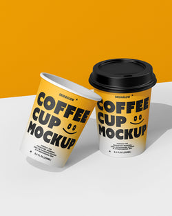 Two coffee cup mockups in leaning arrangement showing customizable branding design