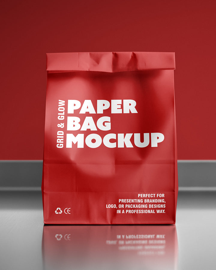 Paper bag mockup in red with front view and glossy surface reflection