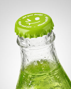 Glass bottle mockup with green painted crown cap and colored liquid with condensation droplets