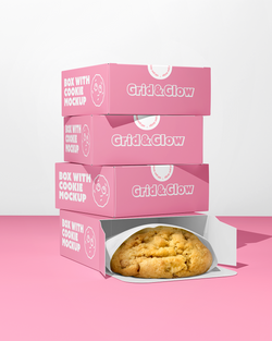Stack of pink boxes with a cookie mockup on a pink background