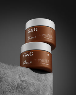 Two Jars Mockup with white lids on a gray surface and dark background