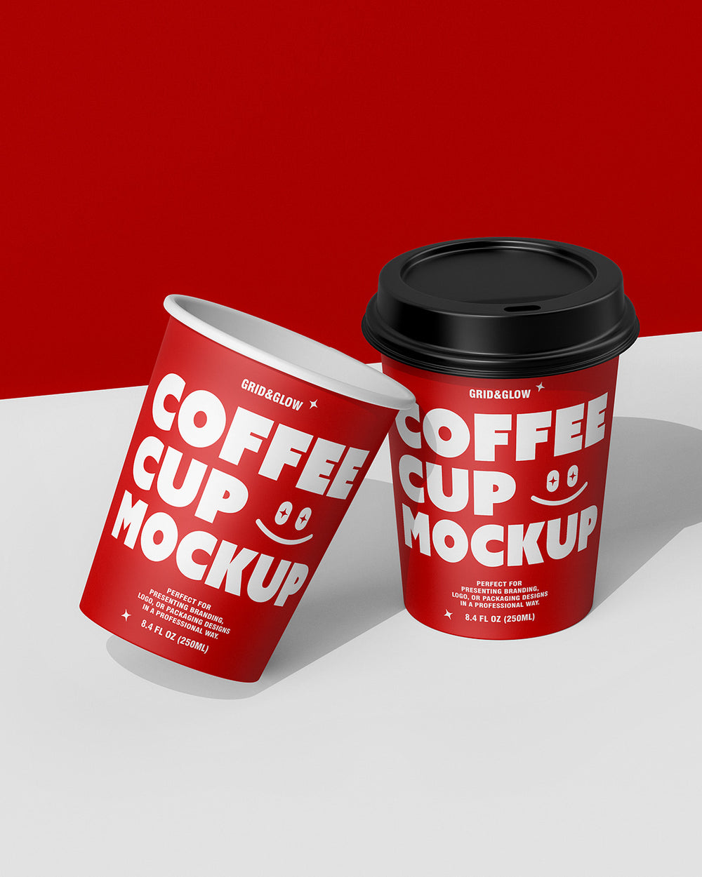 Two coffee cup mockups in leaning arrangement showing customizable branding design red scene