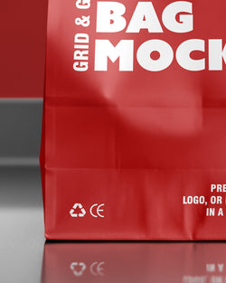Paper bag mockup in red with front view and glossy surface reflection Macro