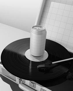Can on a vinyl record with a stylus, resembling a turntable setup. Mockup