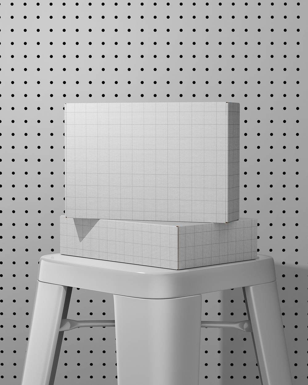 Boxes mockup on a gray stool against a pegboard background