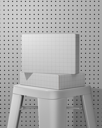 White box Mockup with grid pattern on a gray stool against a pegboard background