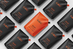 Doy-Pack Mockup – Patterned Layout of Multiple Orange and Black Packs