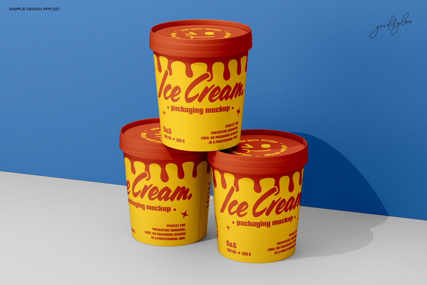 Triangular arrangement of three 12oz ice cream cups with dramatic lighting and blue wall backdrop.