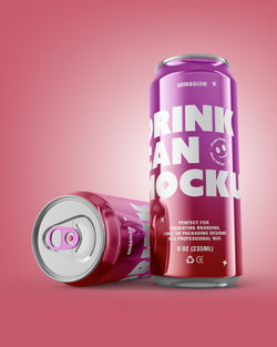 Two purple cans with white text on a pink background